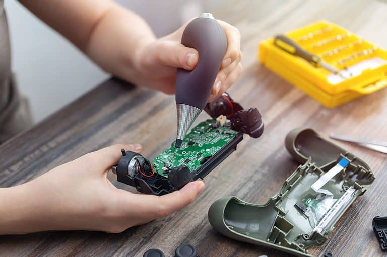 Close up of disassemble game controller repairing, cleaning or diagnostic